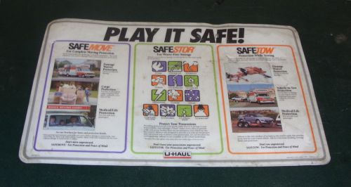 A Collectible U-Haul Dealership Rental Counter Advertising Mat from the 90s