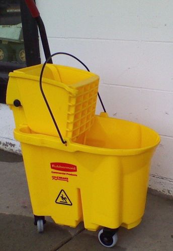 Rubbermaid 7680 safety yellow mop bucket &amp; wringer on wheels wave break equipped for sale