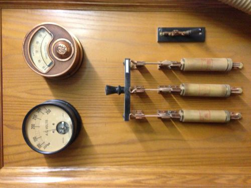Antique GE meters and 3-phase knife switch, mounted on beautiful oak board.