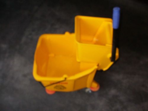 Yellow commercial style mop bucket with wringer and on wheels