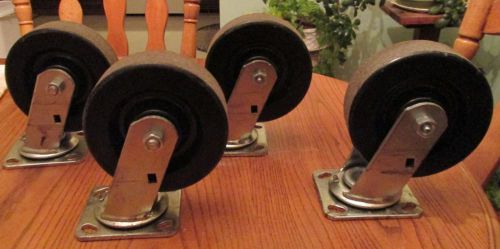 Set of 4 used  swivel steel caster hard plastic wheels 6&#034;x 2&#034; black heavy duty for sale