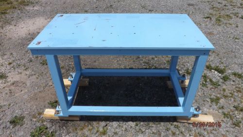 WELDING TABLE, STEEL TOP, WELDED FRAME, ADJUSTABLE FEET 25 x 47.5 inches.