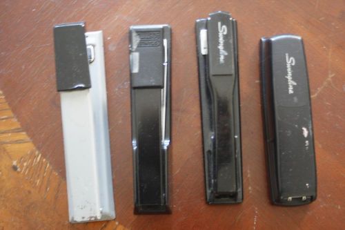 Four (4) used staplers