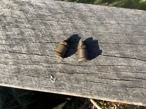 two stationary engine grease things, adjustable
