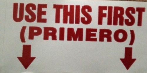 Roll of USE THIS FIRST (PRIMERO) Stickers 5.25 in diameter on a 3 in spool
