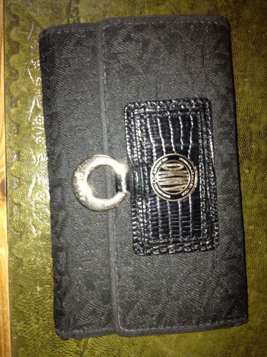 DKNY ladies purse in black material with logo embossed throughout