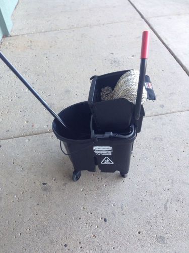 Janitorial mop and bucket.  by rubbermaid. for sale