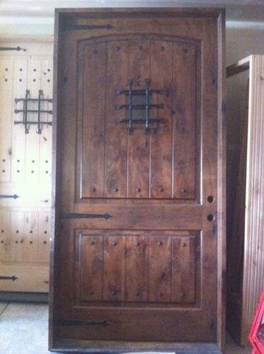 Knotty alder exterior wood door w/ speakeasy massive castle door made for a king for sale