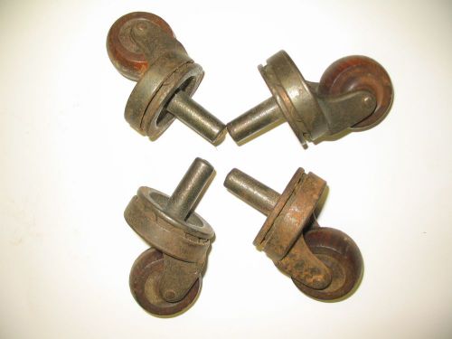 Four vintage heavy duty steel casters with hardwood wheels for sale