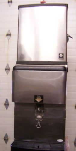 Nice used manitowoc ice machine qd0422a on a ed150 ice dispenser for sale