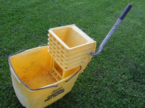 Used yellow rubbermaid 8 gallon mop bucket with ringer for sale