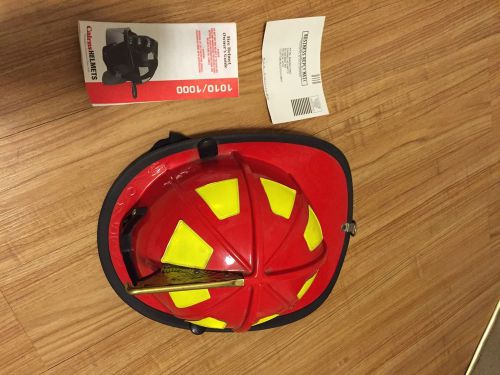Cairns 1010 fire helmet, red, traditional **used**..flaps/straps/front holder, for sale