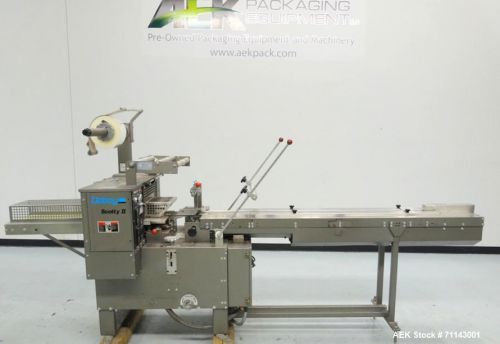 Used- Doboy Model Scotty II Horizontal Flow Wrapper. Utilizes non-registered, st