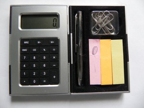 Portable calculator with pen/paper/clips