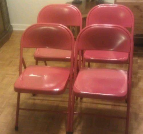 4 red metal chairs
