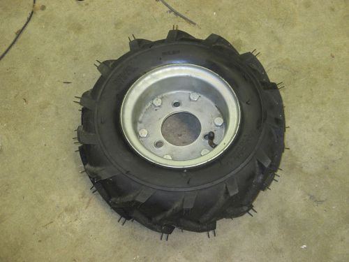 Cleated nylon tire mounted on wheel 13&#034; x 5.00&#034; x 6&#034; 3 1/2&#034; circle bolt pattern