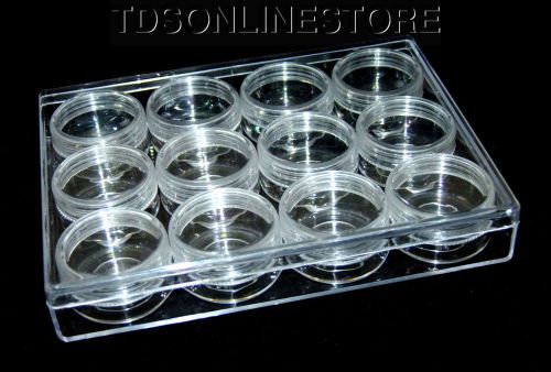 Medium size plastic storage box with 12 clear jars with screw on lids for sale