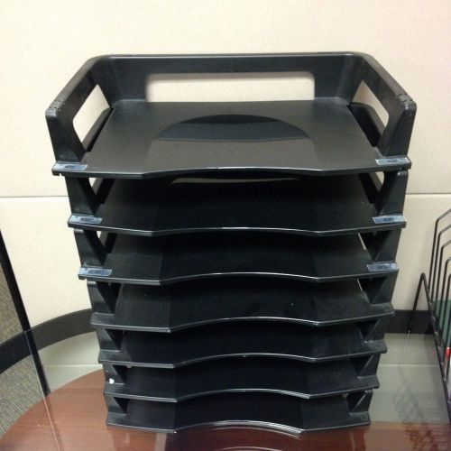 Plastic paper trays. Trays stack conveniently for desktop organization.