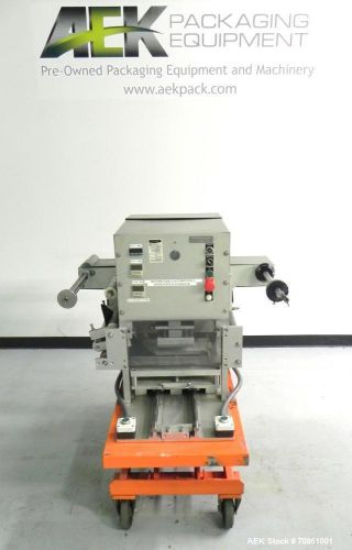 Used- Orics Model M-10 Tray Sealer. Manual load unit capable of speeds up to 10