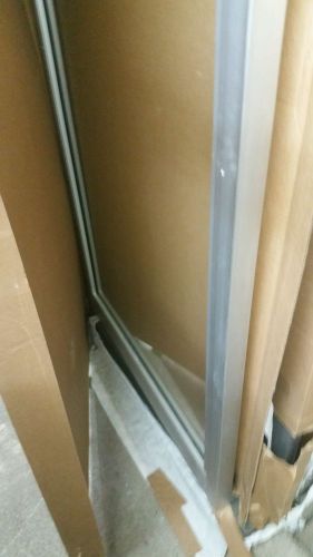 COMMERCIAL ALUMINUM STOREFRONT DOOR AND FRAME ( NEW IN BOX NO GLASS)