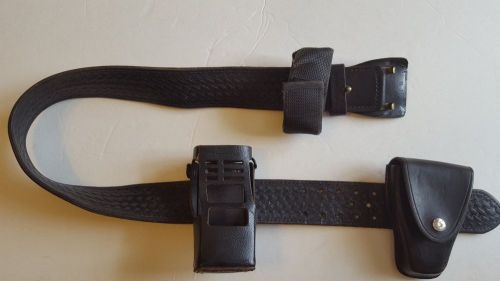 Leather police belt with holster and 2 other accessories.