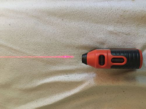 small laser level with red line beam.  perfect for leveling pictures, studs, etc