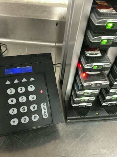 Jtech commercial transmitter and 20 slot pager tower with pagers