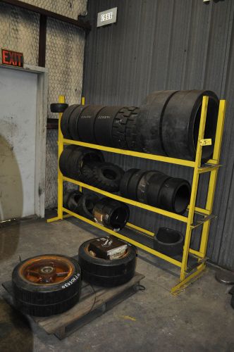 Several Forklift Tires with Rack