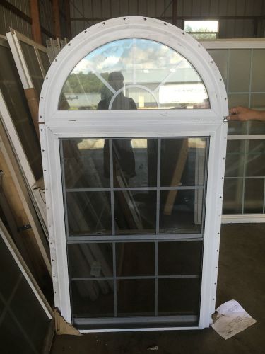 Double hung window with half round