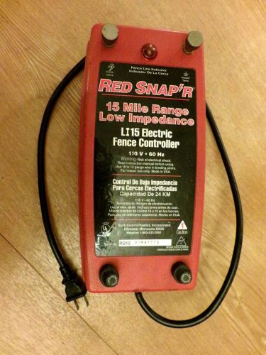 RED SNAP&#039;R ELECTRIC FENCE CONTROLLER,MODEL LI15-15 MILE RANGE LOW IMPENDANCE