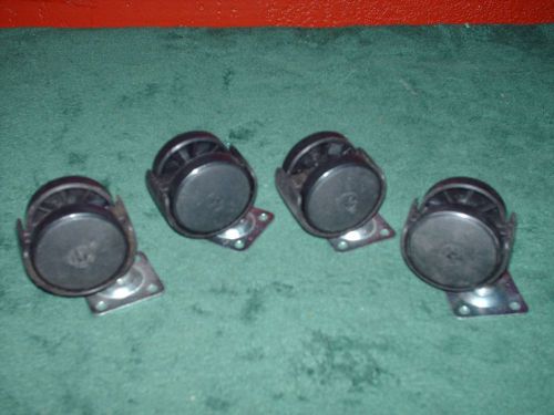 SET OF 4 BLACK SWIVEL PLASTIC 1 1/2 IN. CASTER WHEELS