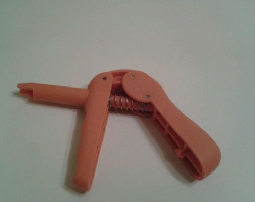 Pistola naranja capsulas de composite, odontologia.