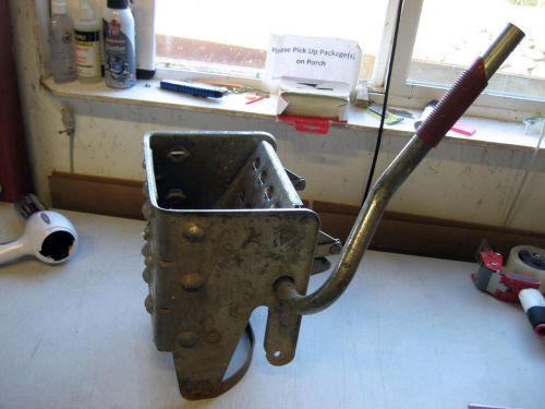 Well used Mop bucket Wring out . metal, dirty &amp; rust spots, but works great