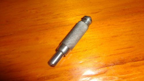 Push button hit center punch automatic string loaded