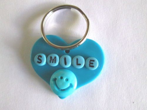 KEY RING HEART WITH SMILEY FACE PURSE. JACKET. DIAPER BAG,KEYS,