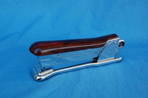 Vintage aceliner stapler model number 502 dark wood grain look brownish red