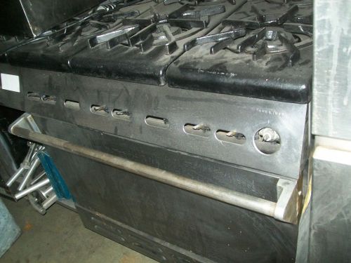 Stove,10 burners, one full size oven combo. black, nat.gas, 900 itesm on e bay for sale