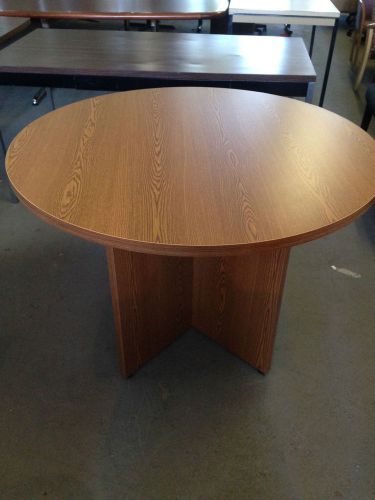 **CONFERENCE TABLE by HON OFFICE FURN 42&#034;DIAM in MED OAK COLOR LAMIN w/ X-BASE**