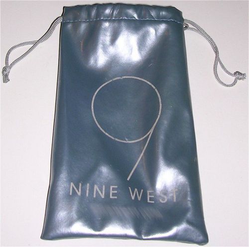 Light blue drawstring pouch by nine west. measured flat: 7&#034;(l) x 4-1/4&#034;(w). used for sale