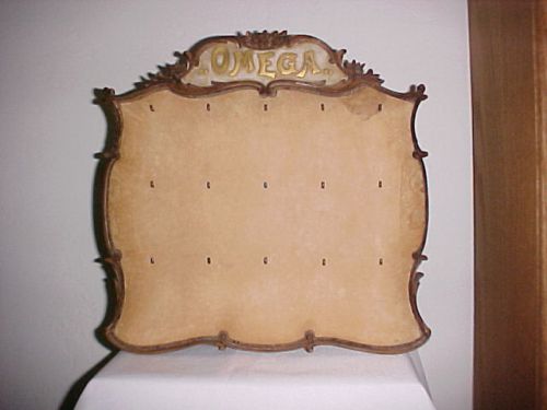 Antique hand carved black forest omega pocket watch advertising display board for sale