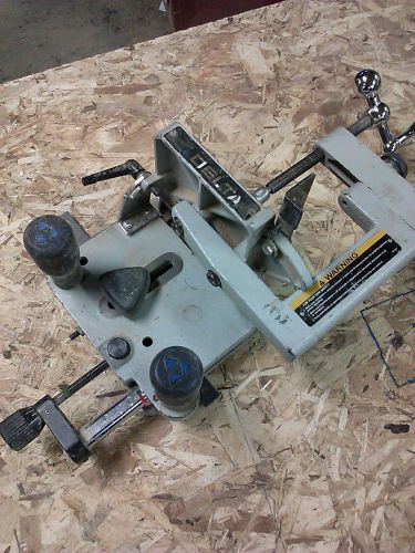 Delta Tenon Jig for your table saw.  Universal-Deluxe Tenoning Jig
