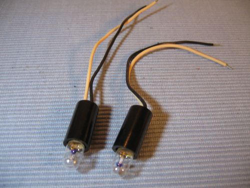 Two bakelite lamp holders for single bayonet lamps, with 6 v. lamps, new for sale