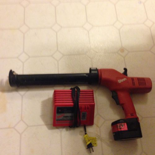 Milwaukee heavy duty 12 volt caulking gun with battery and universal charger for sale