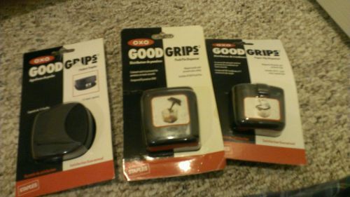 Oxo good grips paper clip dispenser , pocket stapler and push pin dispenser.