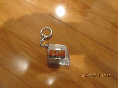 POCKET MEASURING TAPE IN INCHES WITH A KEY CHAIN