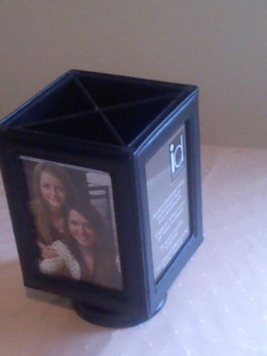 Picture frame and pen holder that spins by Impulse Designs
