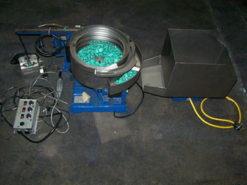 Feeding concepts inc. hopper shaker controlled system for trim tab pin buttons for sale