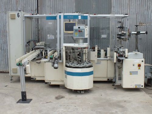 Gima CD840 DISK PACKER MACHINE WITH LABELER. CD-840