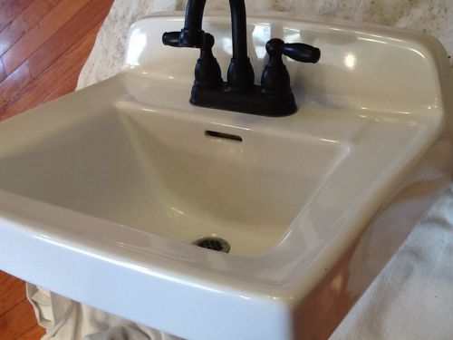 Gerber hand sink porcelain, over flow, wall hanging, arched faucet - used for sale