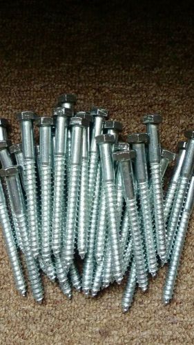 (35) 3/8&#034; x 4&#034; zinc plated lag bolts (heads have been painted brown) w/ washers for sale